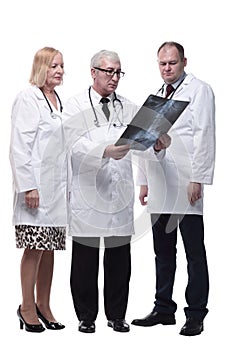 group of leading medical specialists looking at an x-ray.