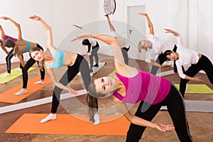 Group lesson on hatha yoga in the studio