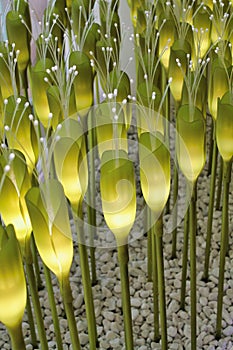 Group of lights inside green plastic  flowers