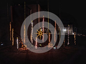 A group of lights that are on a pole, photograph of enchanted garden.