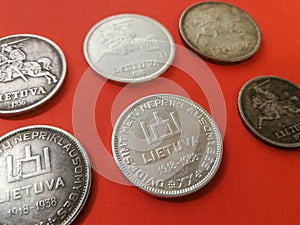Group of lithuanian numismatics coins on the red background
