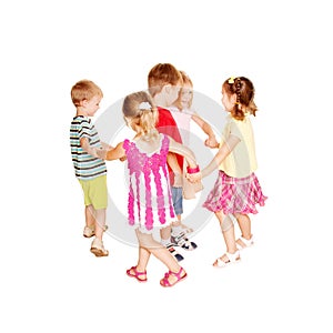 Group of little children dancing, holding hands