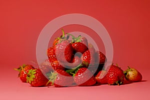 Group of little lovely sweet strawberry with pink background.