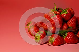 Group of little lovely sweet strawberry with pink background.