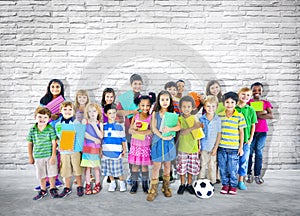 Group of Little students Standing Close to the Wall