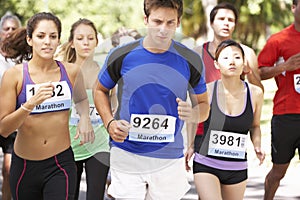 Group Of Marathon Runners At Start Of Race