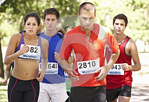 Group Of Marathon Runners At Start Of Race