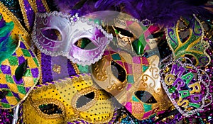 Group of Mardi Gras Mask on dark background with beads