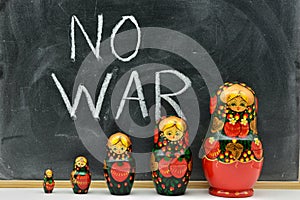 Group of matryoshka dolls with the background of a blackboard photo