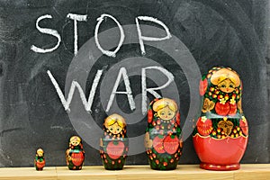 Group of matryoshka dolls with the background of a blackboard photo