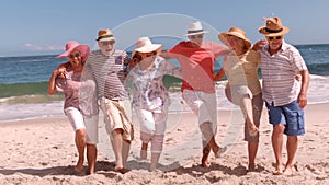 Group of mature people dancing arm in arm