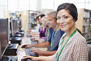 Group Of Mature Students Working At Computers