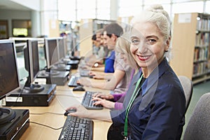 Group Of Mature Students Working At Computers