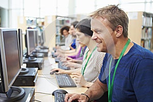 Group Of Mature Students Working At Computers