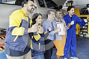 Group of mechanics men and woman with cheerful