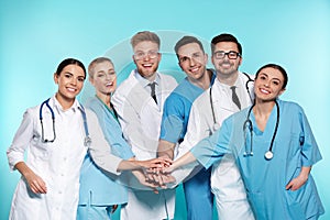 Group of medical doctors on color background