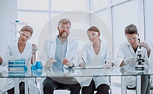 Group of medical experts checking the quality of fruit