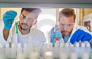 Group of medical research scientists collectively working in laboratory