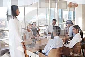 Group Of Medical Staff Meeting Around Table In Hospital photo