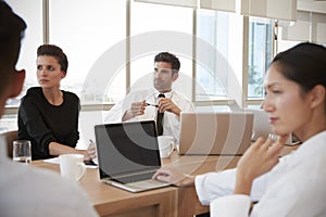 Group Of Medical Staff Meeting Around Table In Hospital