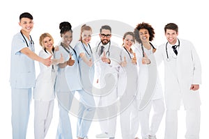 Group Of Medical Team Gesturing Thumbs Up