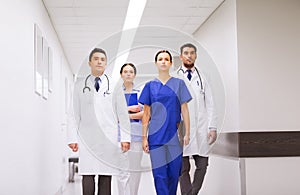 Group of medics or doctors at hospital corridor