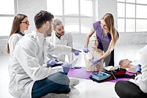 Group of medics during the first aid training indoors