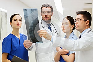 Group of medics with spine x-ray scan at hospital