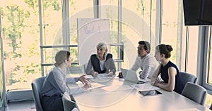 Group meeting led by businesswoman gather in office boardroom