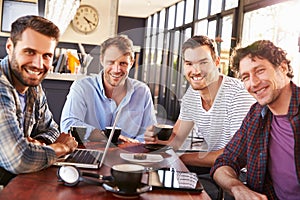 Group of men meeting at a coffee shop, portrait