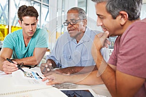 Group Of Men Meeting In Creative Office