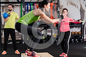 Group of men and woman in functional training gym