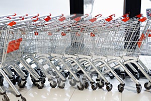 Group of metal shopping carts in city supermarket