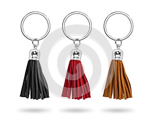 A group of metallic souvenir. Tassel key ring isolated on white background. Fashion leather key chain for decoration