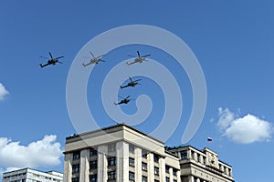 A group of Mi-28N `Night hunter` attack helicopters in the sky over Moscow during the parade dedicated to the 75th anniversary of