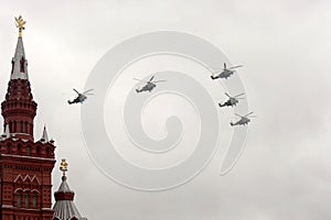 A group of Mi-35 M and Mi-24 attack combat helicopters in the sky over Moscow`s Red Square during the Victory Air Parade