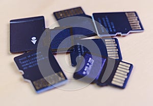 Group of MicroSD cards over a wooden table