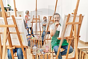 Group of middle age draw students smiling happy drawing at art studio