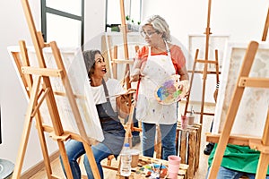 Group of middle age students drawing at art studio