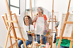 Group of middle age students drawing at art studio