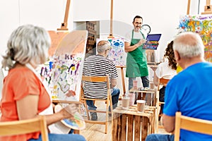 Group of middle age students having draw lesson at art studio