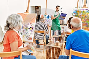 Group of middle age students having draw lesson at art studio