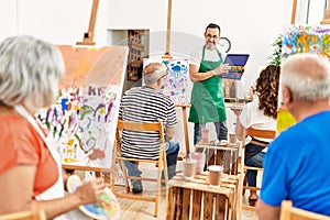 Group of middle age students having draw lesson at art studio