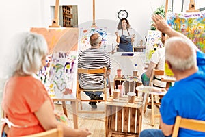 Group of middle age students having draw lesson at art studio