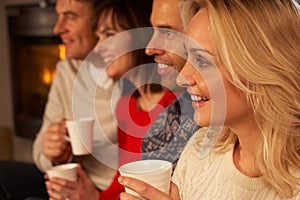 Group Of Middle Aged Couples With Hot Drinks