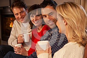 Group Of Middle Aged Couples With Hot Drinks