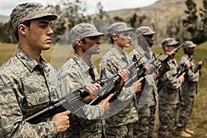 Group of military soldiers standing with rifles