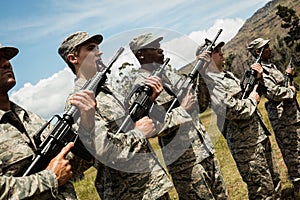 Group of military soldiers standing with rifles