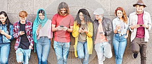 Group of millennial friends watching social story on smart mobile phones - People addiction to new technology trend - Concept of