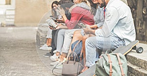 Group of millennials friends using smartphones  outdoor - Happy people having fun with technology trends after university lesson